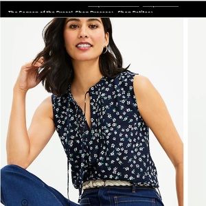 Loft Daisy ruffle tie neck shell.